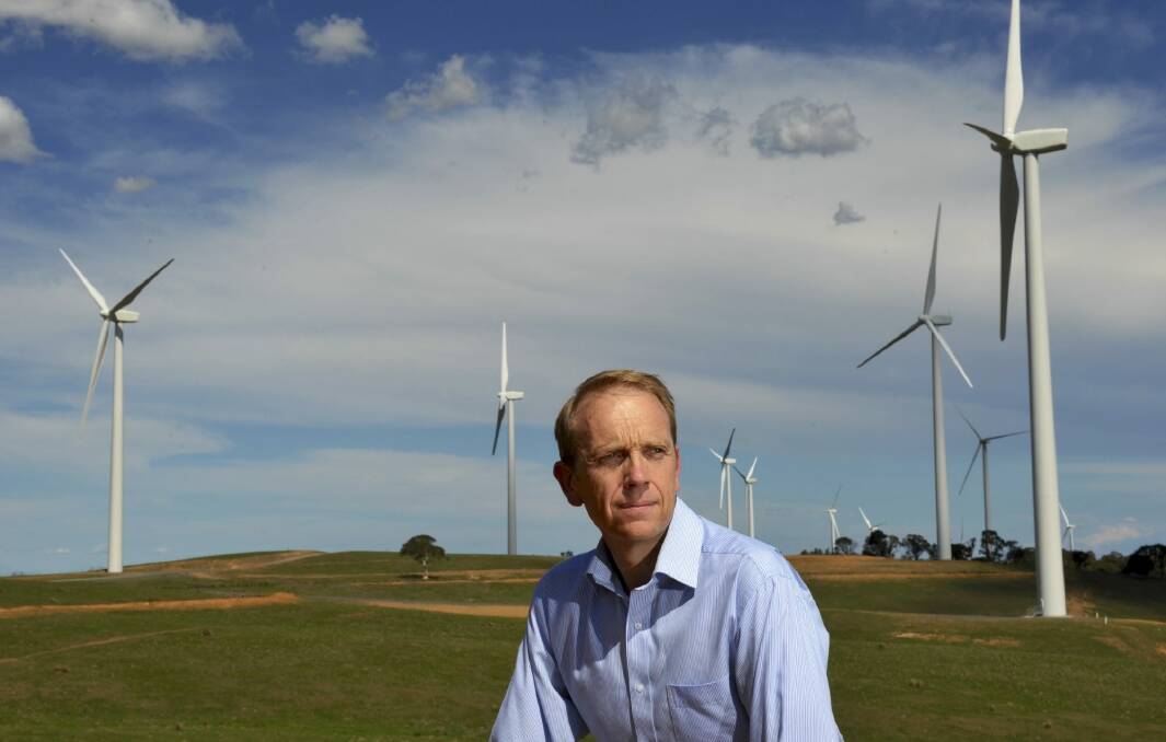 Simon Corbell, pictured at the Acciona Energy wind farm at Gunning, has championed renewable energy during his time in the ACT government.  Photo: Graham Tidy