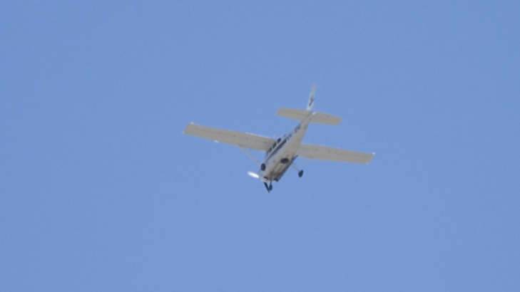 Police say the Cessna seen flying over Canberra is doing 3D-mapping work for Yahoo. Photo: Richard Tuffin