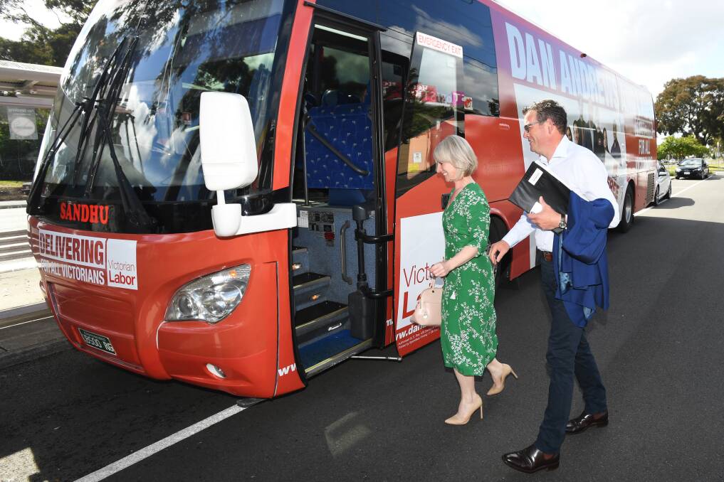 Victorian Premier Daniel Andrews and wife Catherine Andrews board the Labor bus in Noble Park on Wednesday. Photo: AAP
