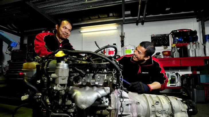 Mechanics Romeo Balbin and Hilario Garrido at the Bridgestone Service Centre, Fyshwick. Photo: Melissa Adams