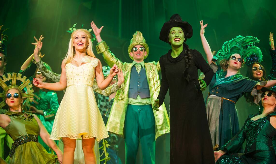  Laura Murphy, left in white, as Glinda and Loren Hunter, right, in black  as Elphaba in <i>Wicked</i> which won five CAT Awards. Photo: Elesa Kurtz