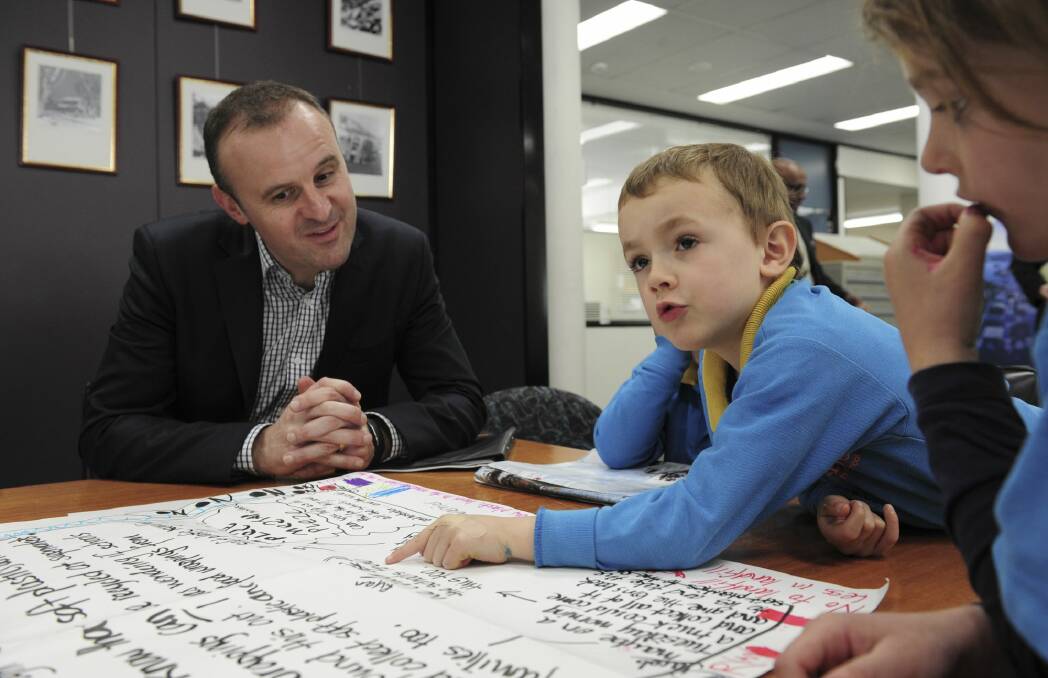 Chief Minister Andrew Barr has a chat at the Woden Library with students from the Lyons Early Childhood School. Photo: Graham Tidy