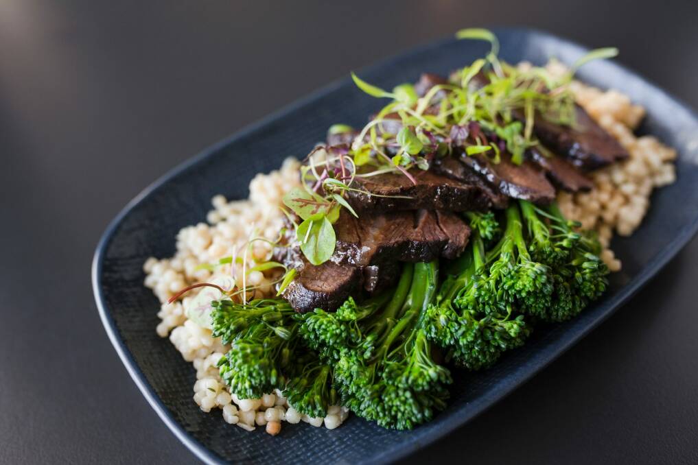 Angus beef cheeks are 12 hours braised, with pearls of cous cous, and broccolini. Photo: Jamila Toderas