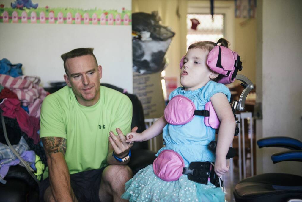 Trevor Dell with 3-year-old daughter Abbey who suffers a rare genetic disorder CDKL5.

 Photo: Rohan Thomson