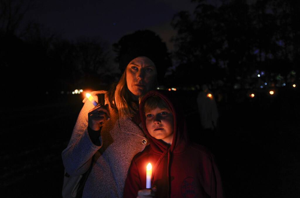 Erin Regan and her son Seth Mulvey, 9, pay tribute to Ms Regan's sister Leanne, who died as a result of domestic violence. Photo: Melissa Adams