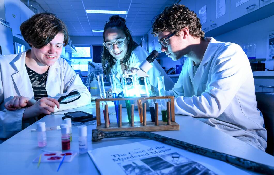 Fitzroy High School students Arabella Hope, Alice Huxtable and Roy Meuleman overhauled their elective program and introduced a forensics subject where students solve crimes.   Photo: Justin McManus