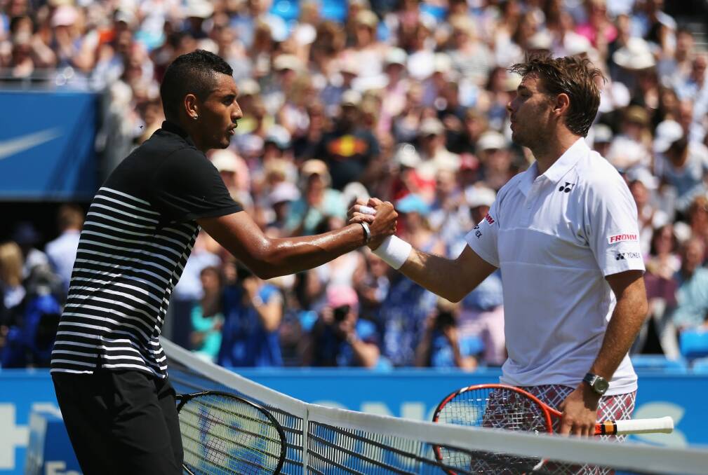 Switzerland's Stanislas Wawrinka, right, shakes hands with Australia's Nick Kyrgios at the Aegon Championships at Queen's Club in England last year.  Photo: Clive Brunskill