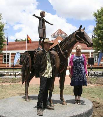 Braidwood artists Andy Townsend and Suzie Bleach with one of their sculptures, in the grounds of the Canberra Grammar School. Photo: Alex Rea