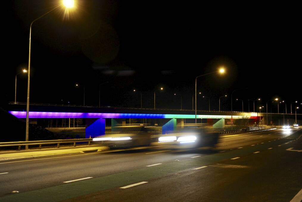Coloured lights illuminate the Malcolm Fraser Bridge over the Molonglo River at Pialligo. Photo: Graham Tidy
