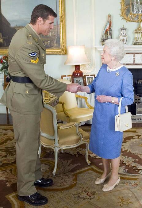 Corporal Ben Roberts-Smith with the Queen in 2011. Photo: Reuters