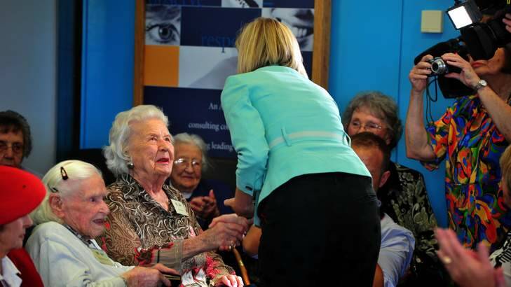Chief Minister Katy Gallagher presents Bobbie Miller with her medallion. Photo: Karleen Minney