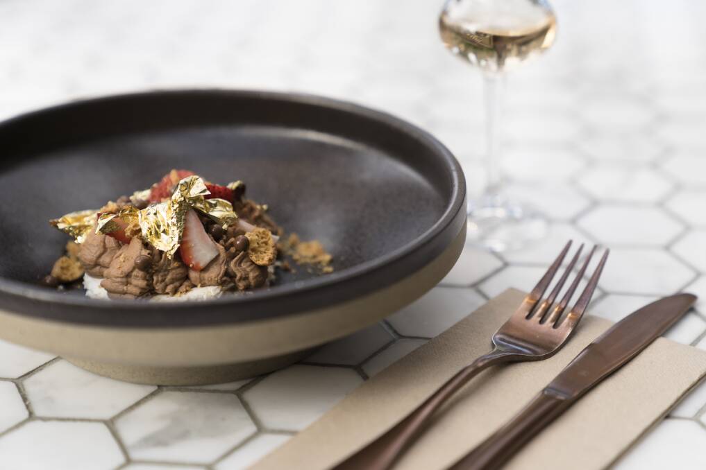 Chocolate mousse served with strawberries, honeycomb and gold leaf.  Photo: Lawrence Atkin