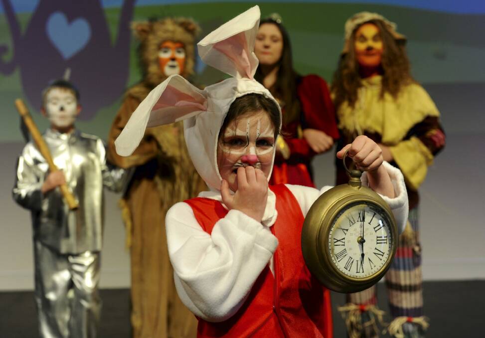 Rabbit, played by Imogen Baggoley, 8, is very late to an important date. She is joined by the Tin Man, left, played by Joss Kent, the Lion (Karissa Nicholson), the Queen of Hearts (Shaylah McClymont) and the Scarecrow (Charlotte Gee).  Photo: Graham Tidy
