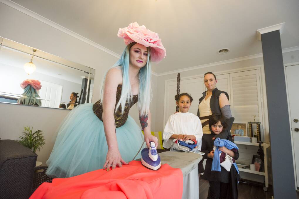 Prepping their costumes: Cosplayers Isabella Hurst, and Sophie, Alysha and Elijah Khokhar. Photo: Dion Georgopoulos