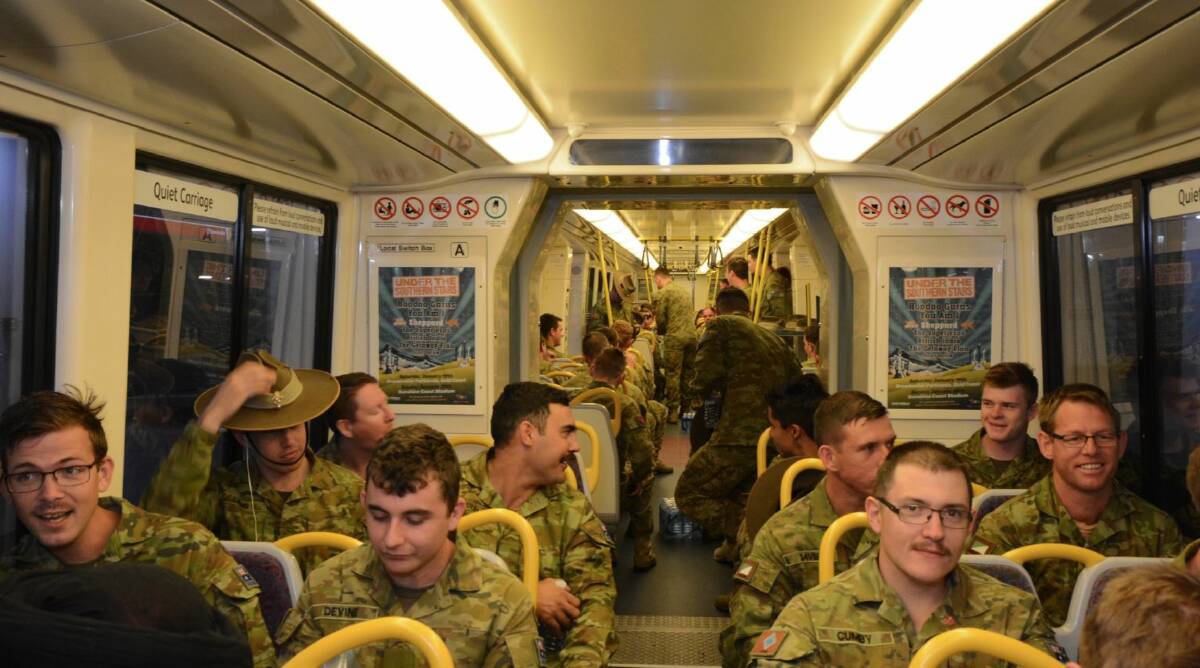 Service personnel on board Sunday's Remembrance Day troop train. Photo: Twitter/Queensland Rail