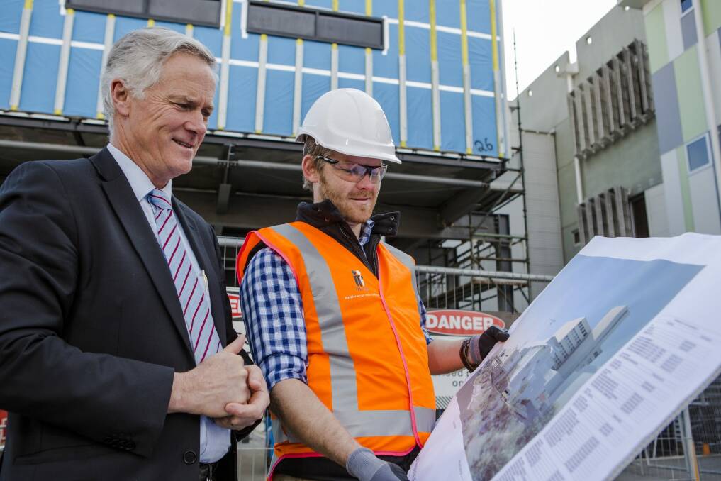 Deputy Director-General of Health Infrastructure Paul Carmody and General Manager of Isis Group Australia Ben Wright oversee the hospital's expansion. Photo: Jamila Toderas
