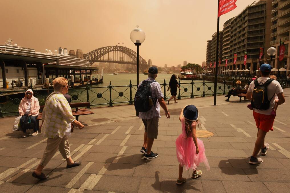 A strong wind change has swept dust over Sydney on Thursday. Photo: Nick Moir