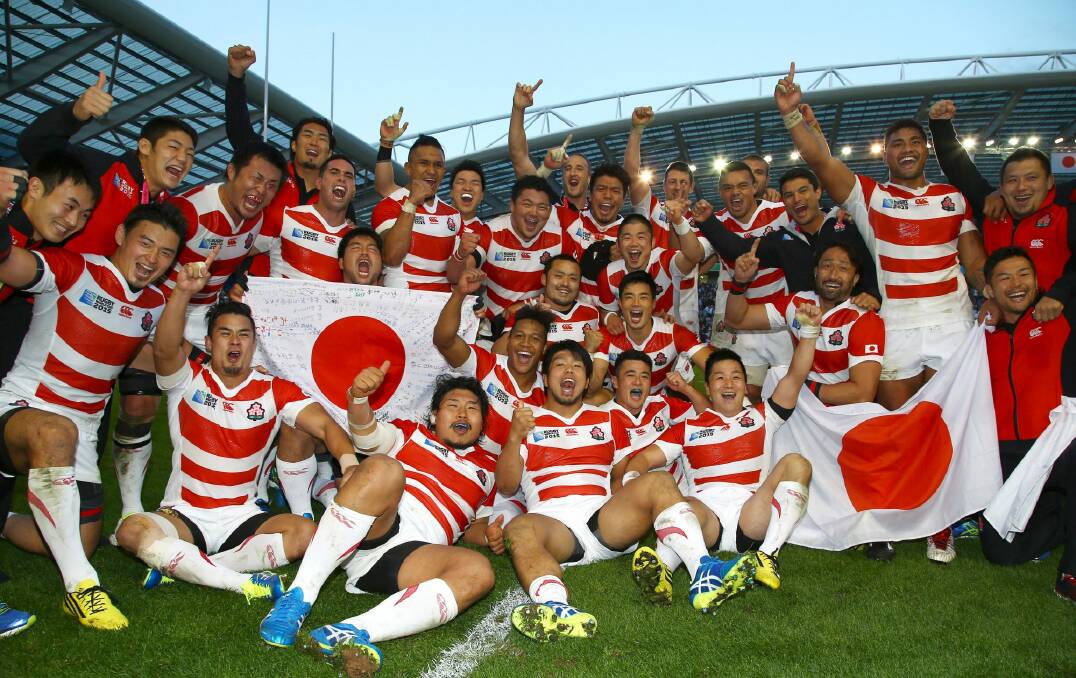 Cherry Blossoms in bloom: Japan players celebrate after defeating South Africa. Photo: Gallo Images