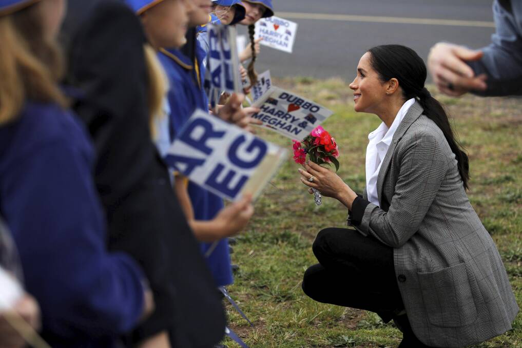Meghan, Duchess of Sussex talks with students from Dubbo South Public School in Dubbo. Photo: Reuters Pool.