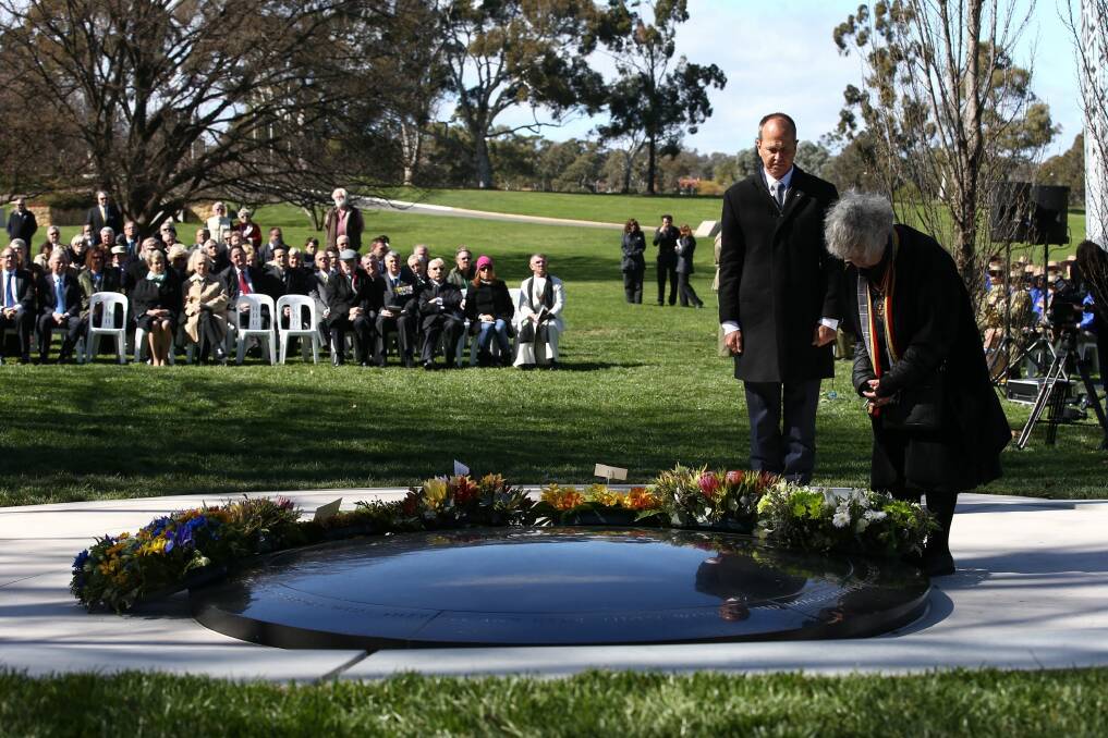 Shirley Shackleton and Peter Greste lay wreaths for war correspondents and their families at the dedication of the War Correspondents Memorial. Photo: Andrew Meares