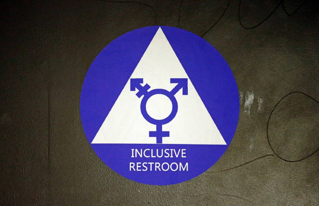 A sticker designates a gender neutral bathroom at Nathan Hale high school in Seattle.  Photo: ELAINE THOMPSON