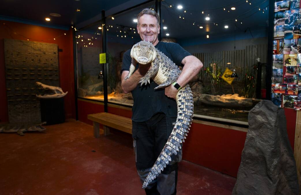 Owner Peter Childs with the first saltwater crocodile 'Charlie' at his new home at the Canberra Reptile Zoo. Photo: Elesa Kurtz