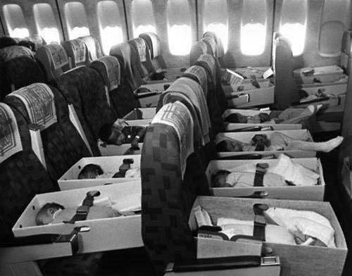 Canberra man Rohan Samara's photograph of infants from Vietnam being airlifted to Australia in 1975. He was one of the babies in the cardboard boxes being brought to a new life in Australia. Photo: Supplied
