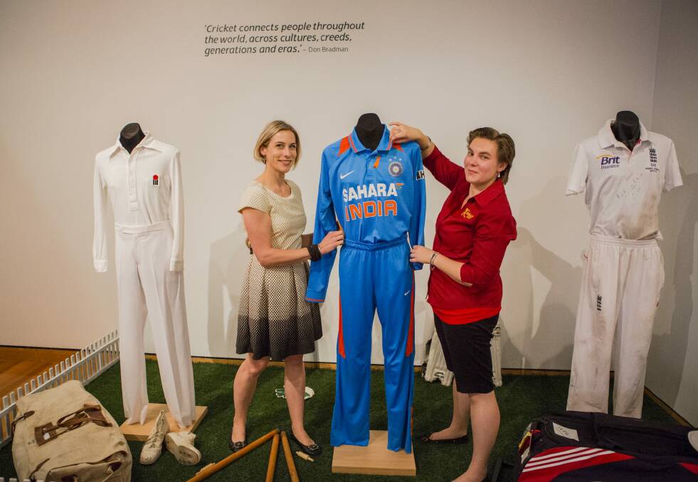 Padding up: Social History Curator of the Canberra Museum and Gallery Sharon Bulkeley, left, and Assistant Curator of the Bradman Museum Belinda McMartin at the Bradman exhibition at Canberra Museum and Gallery.
 Photo: Jamila Toderas