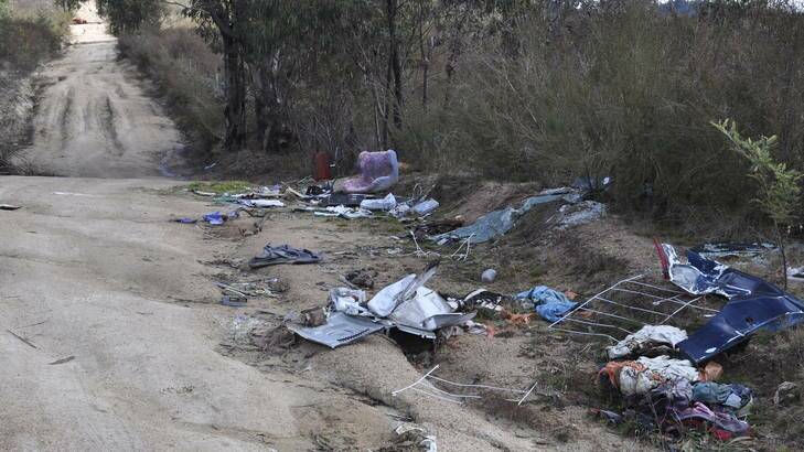 An assortment of rubbish - including a kitchen sink - dumped near Gibraltar Peak on the edge of Tidbinbilla Nature Reserve. Photo: Justin Ryan