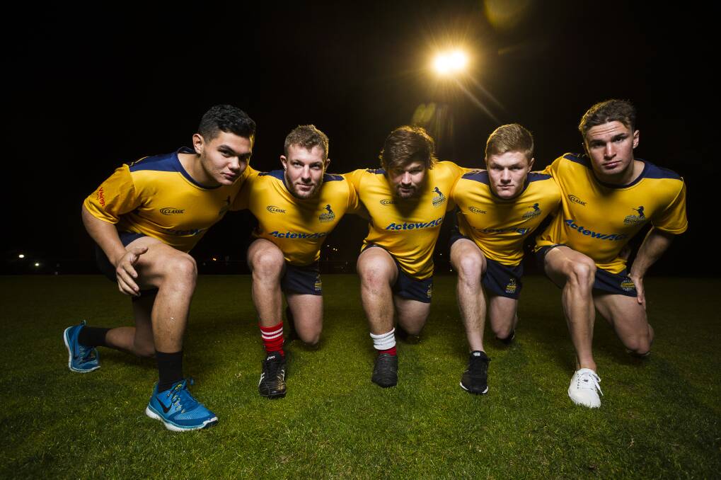 Noah Lolesio, left, was one of several young guns invited to Brumbies training last year. Photo: Dion Georgopoulos