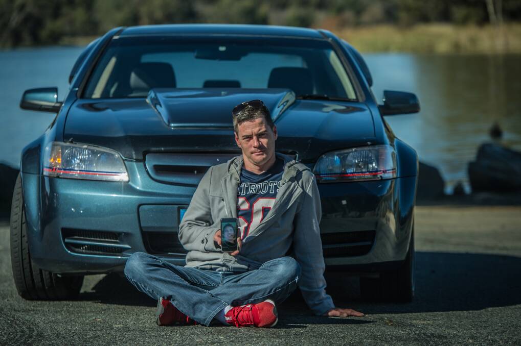 Justin Hogg in front of his prized Holden Commodore, which he is taking on a car cruise he has organised for Saturday in memory of his brother Adrian, who died in a motorbike crash. Photo: Karleen Minney