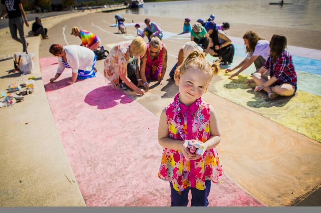 Canberrans have taken part in a global paint-a-rainbow day. Four-year-old Alana Ridgeway, of Rivett, was by the lake.  Photo: Jamila Toderas
