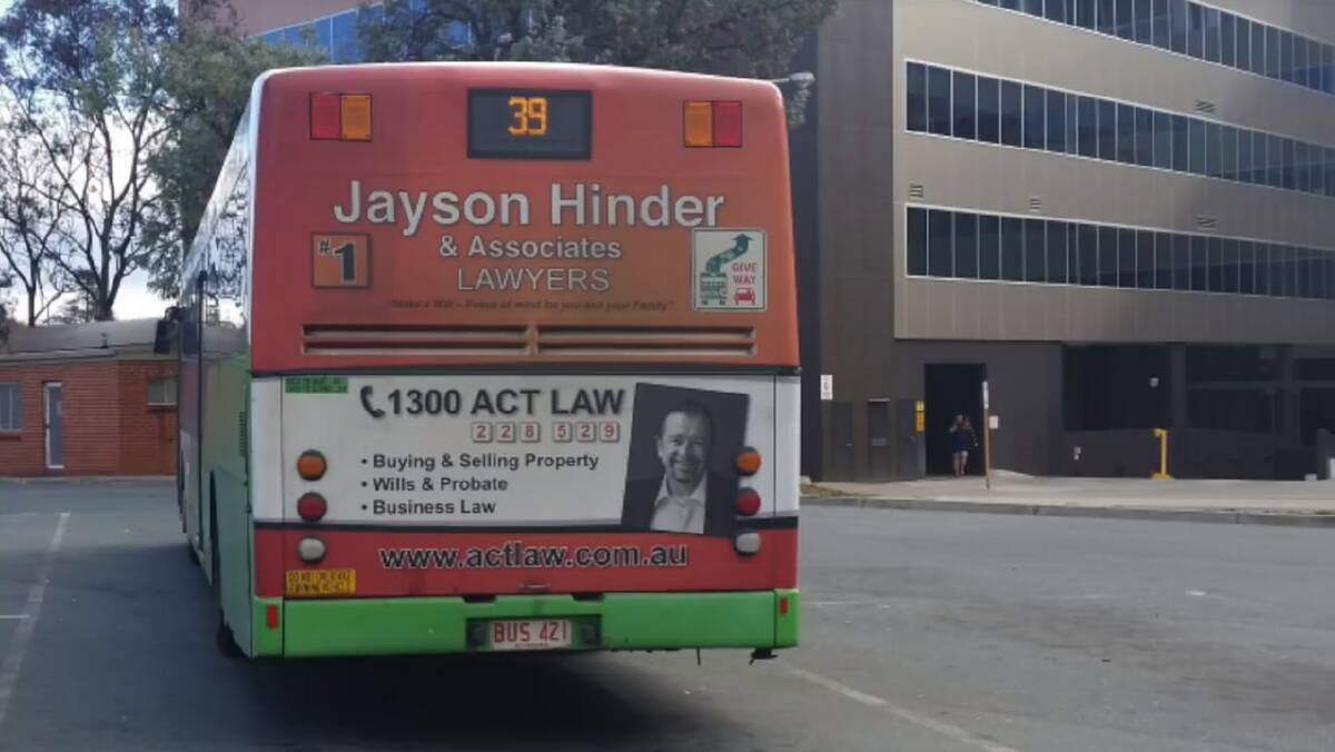 Jayson Hinder's ad on the back of an ACTION bus. The image is from a video on his Facebook page urging Labor members to preselect him. Photo: Richard Fox