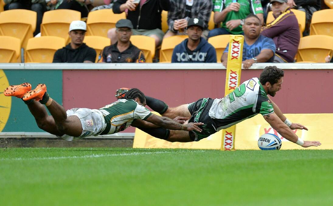 Winging it: Zac Santo scores a try in Townsville's Queensland Cup grand final loss to Ipswich in September. Photo: Getty Images