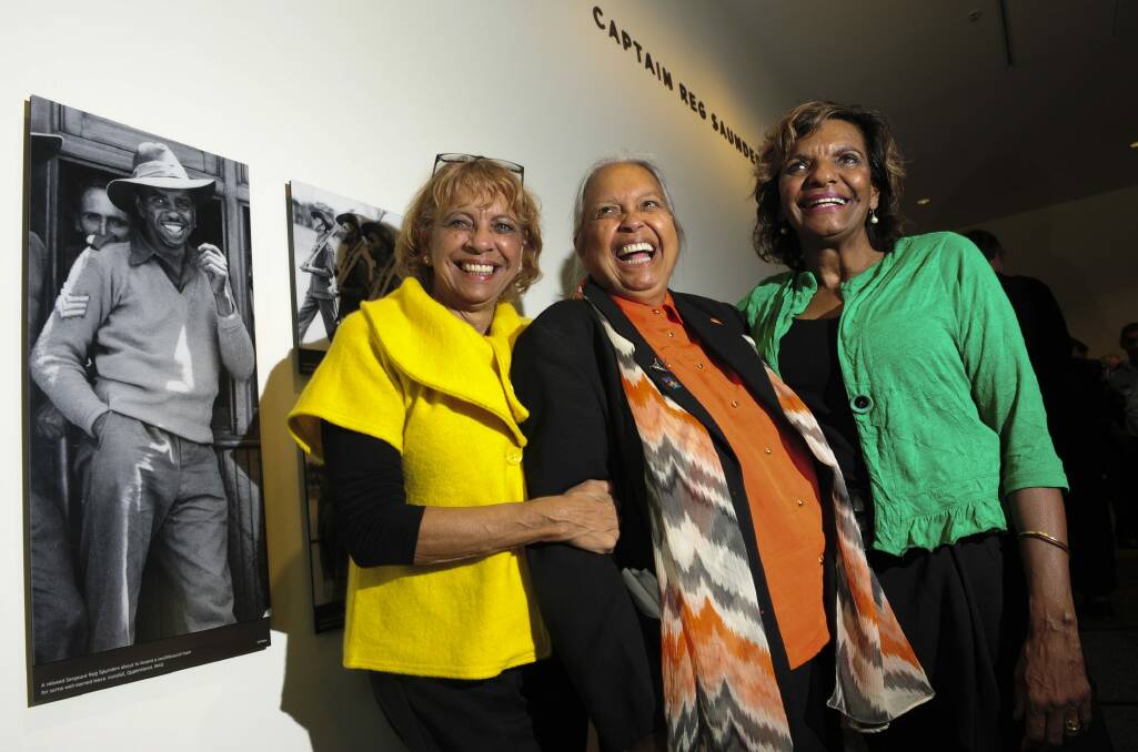 Captain Reg Saunders' daughters Dorothy Burton, Glenda Humes and Judith Standen inside the gallery named after their father. Photo: Graham Tidy