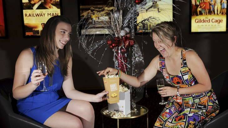 POP IN: Palace Electric's Emily Clarke (left) and Lavanna Neal get in the mood for Christmas Day. Photo: Graham Tidy