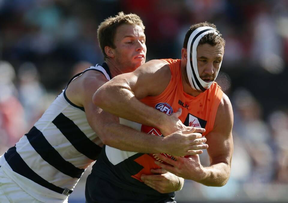 Shane Mumford of the Giants marks the ball during the round two AFL match between the Greater Western Sydney Giants and the Geelong Cats on Sunday. Photo: Mark Metcalfe
