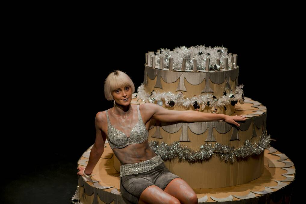 Fresh Funk Dancer Hannah Miners with a giant cake in celebration for 25 years of Tuggeranong Community Arts. Photo: Jamila Toderas