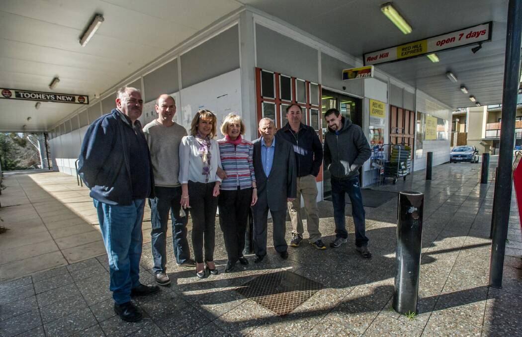 The five sons of Olympia and Chris  Maleganeas (middle) grew up in the Red Hill shops. Four of the sons are pictured here (l-r) John, 51; Michael, 50 (with his wife Rachel); Steven, 48; and Con, 39. (Christopher, 45, was interstate) Photo: Karleen Minney