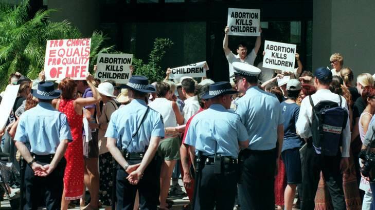 Anti-abortion protesters gather outside a courthouse. Protests such as these will soon be banned from within a certain distance of abortion clinics in Tasmania. Photo: Barry Baker
