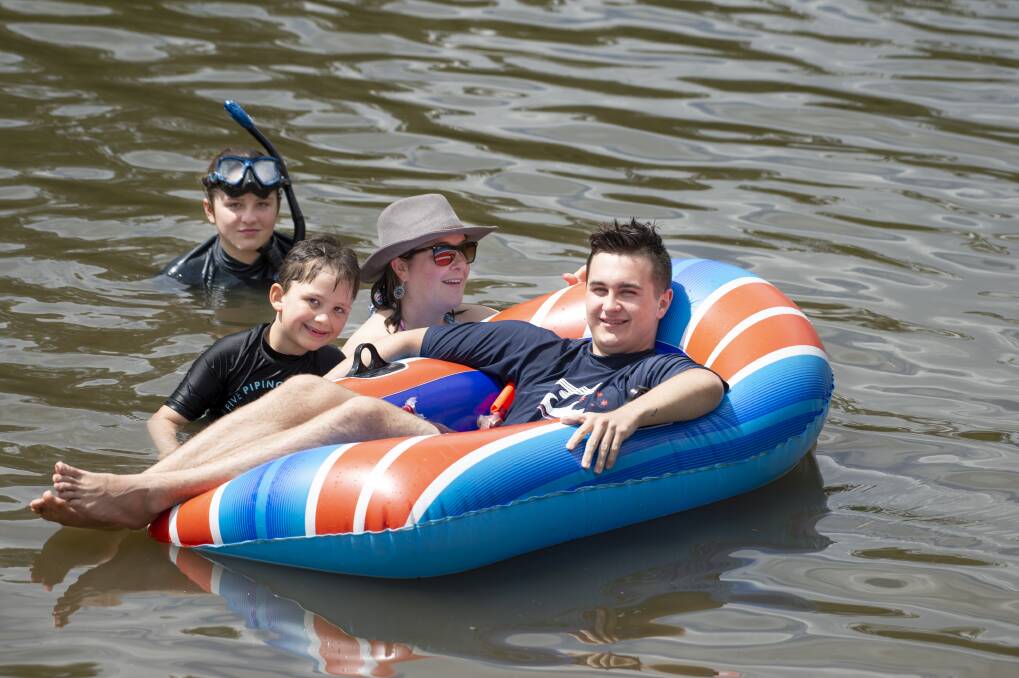 Canberra woman Michelle Love, pictured swimming at Casuarina Sands with her children Jazmin, 12, Axel, 6, and Jayden, 16, has welcomed a proposal for lifesavers to patrol the ACT's inland waterways. Photo: Sitthixay Ditthavong