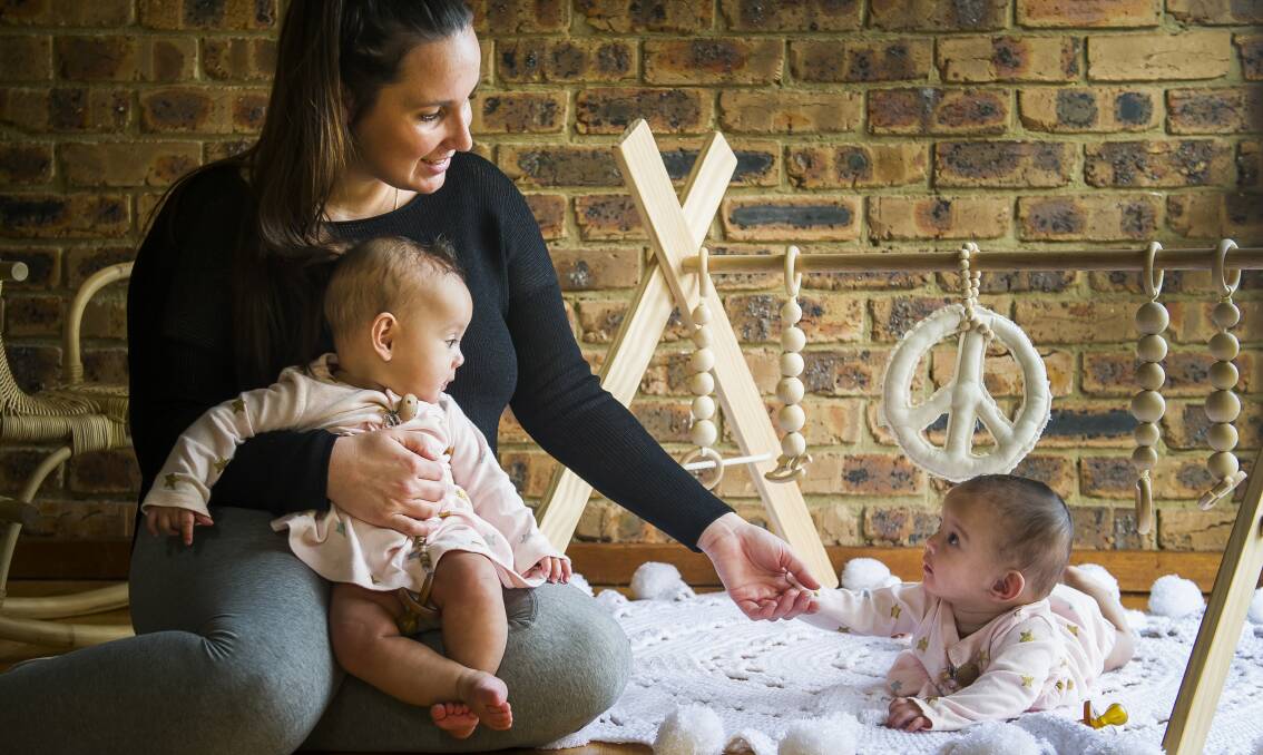 Camille Aniversario, with her 7 month old twins Franki and Gigi, Photo: Elesa Kurtz