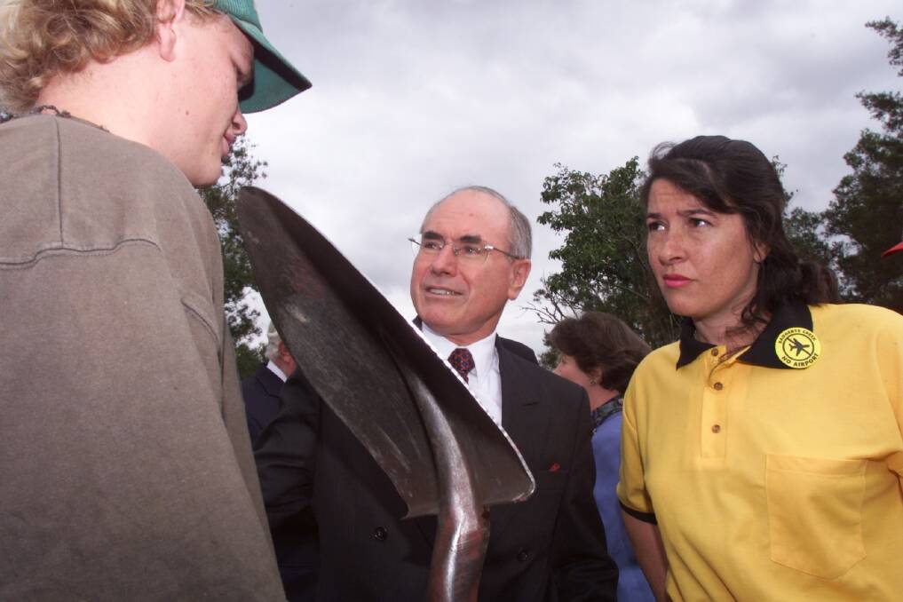 The then Liberal member for Lindsay, Jackie Kelly, right, with then prime minister John Howard on the campaign trail of the 1998 election. Howard won because he introduced taxation reform. Photo: Mike Bowers