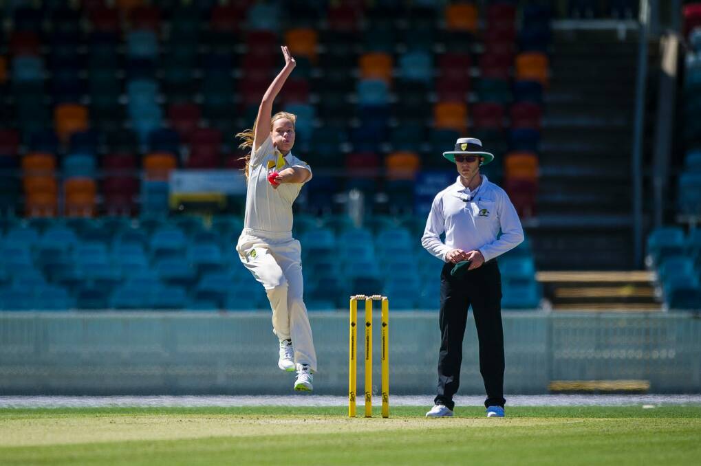 Lauren Cheatle throwing a fast ball in the Australia Vs ACT women's Ashes warm-up match. Photo: Dion Georgopoulos