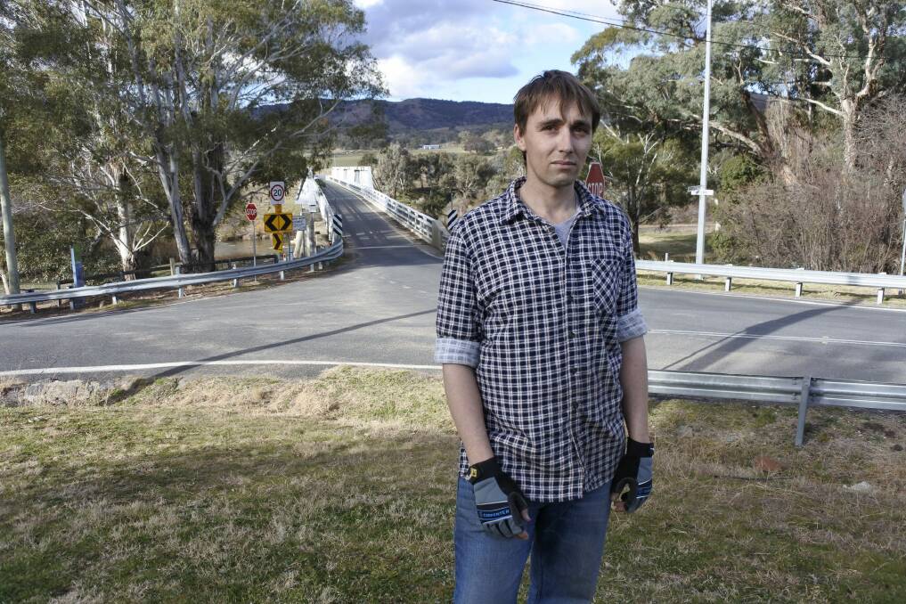 Shane Trevor has lived near the historic bridge in Tharwa for about three years. Photo: Kimberley Le Lievre