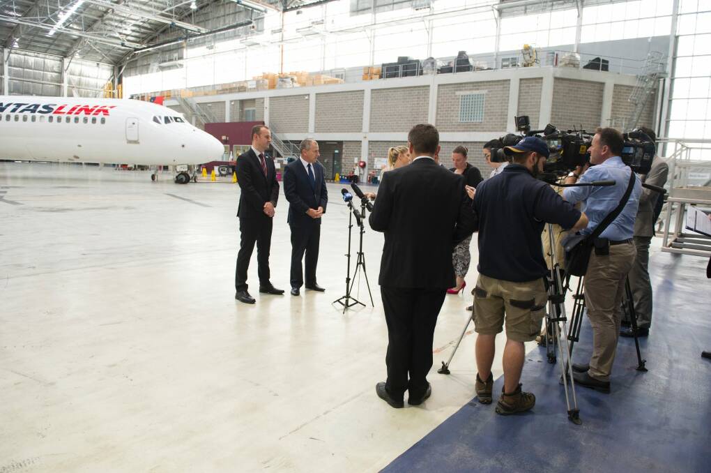 Journalists at a press conference with ACT Chief Minister Andrew Barr and QantasLink boss John Gissing Photo: Jay Cronan