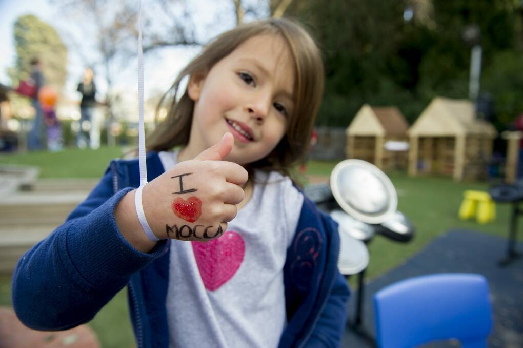 Julia Armstrong, 4, shows her support at the cake table for the I Love MOCCA campaign launch.  Photo: Jay Cronan