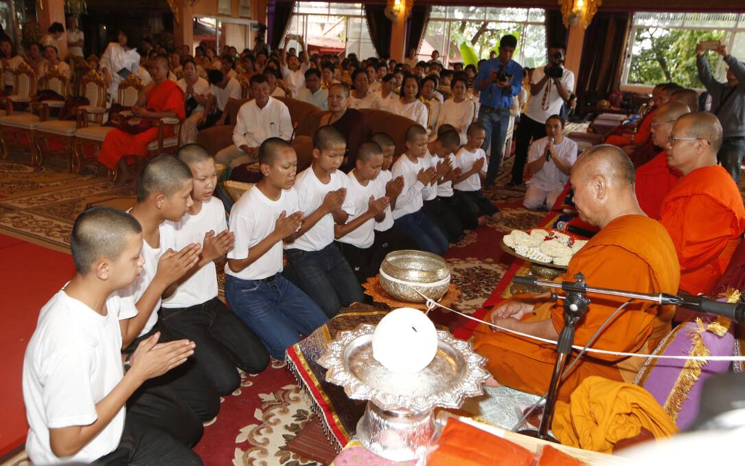 Members of the Wild Boars soccer team serving as novice Buddhist monks. Photo: AP