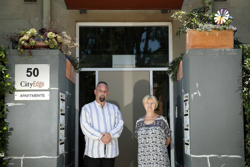 Neighbours Gerard Jenkins and Terez McGivern have been asked to remove pot plants near the front door to their building.   Photo: Jeffrey Chan