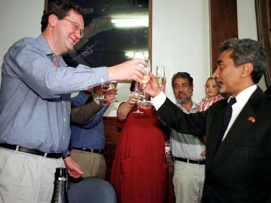 Before the storm: Alexander Downer toasts then economic affairs minister Mari Alkatiri in 2001 after signing a preliminary deal to split gas revenues from the Timor Sea.